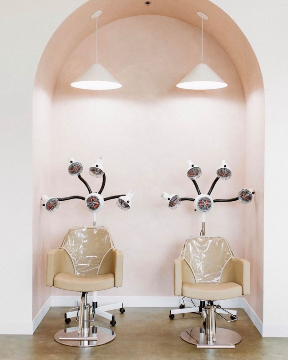 two infrared hair color processors and salon chairs with covers