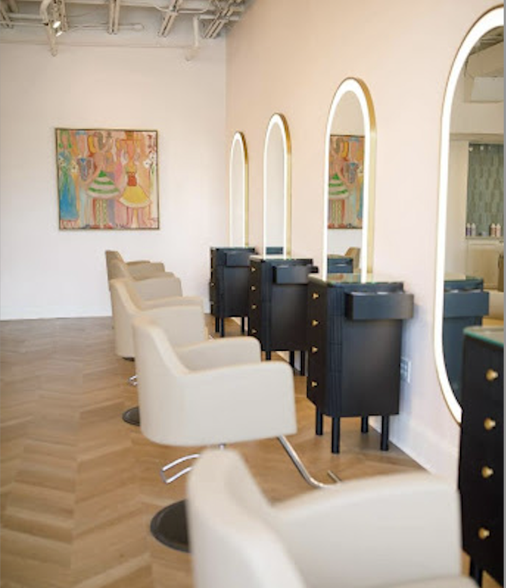 rounded LED mirrors in salon